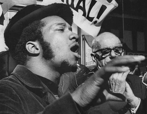 Fred Hampton and Benjamin Spock at a protest rally outside the Everett McKinley Dirksen U.S. Courthouse in Chicago, 1969